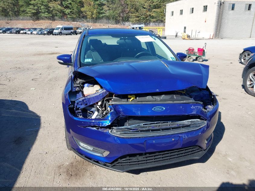 2015 Ford Focus Titanium VIN: 1FADP3N25FL321103 Lot: 43423802