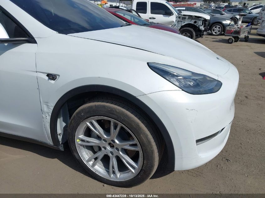 2023 Tesla Model Y Awd/Long Range Dual Motor All-Wheel Drive VIN: 7SAYGDEE5PA035557 Lot: 43447239