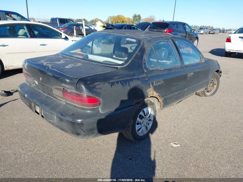 1Y1SK5269SZ092656 1995 GEO PRIZM photo no. 4
