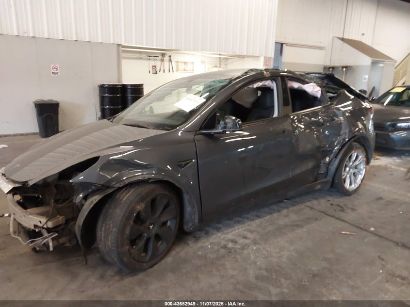 2023 Tesla Model Y Awd/Long Range Dual Motor All-Wheel Drive VIN: 7SAYGAEE6PF882606 Lot: 43652949