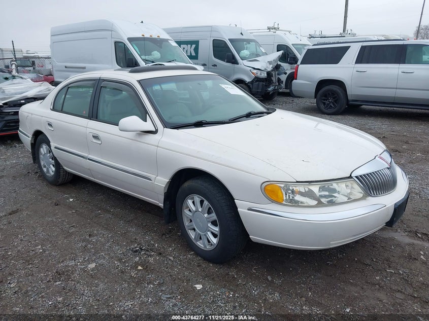 1LNHM97VXXY703416 1999 Lincoln Continental auction photo 1