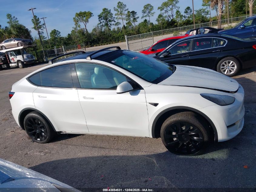 2023 Tesla Model Y Awd/Long Range Dual Motor All-Wheel Drive VIN: 7SAYGAEE2PF640590 Lot: 43854531