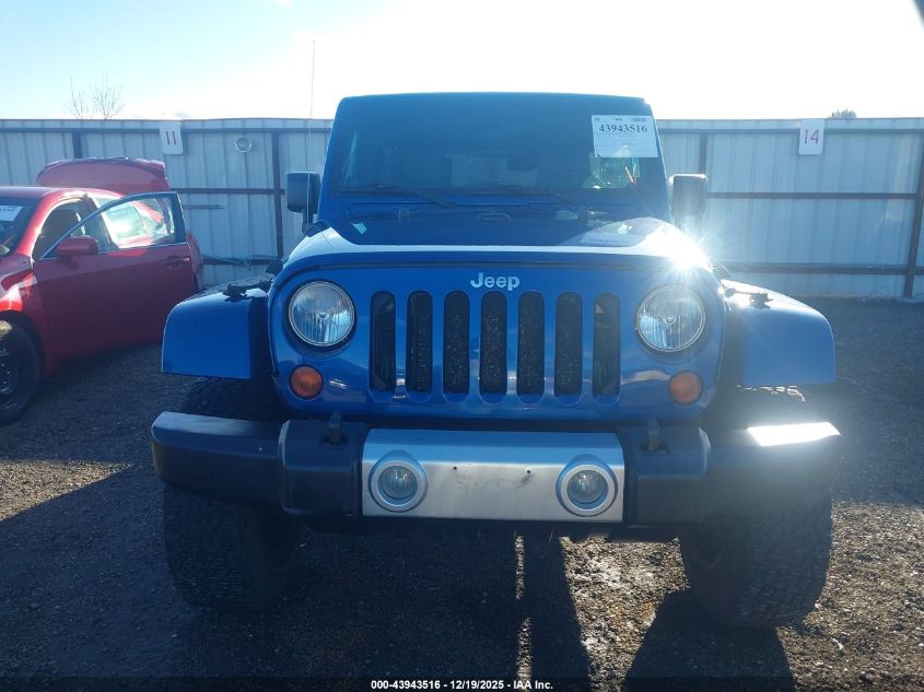 2009 Jeep Wrangler Unlimited Sahara VIN: 1J4GA59149L776609 Lot: 43943516