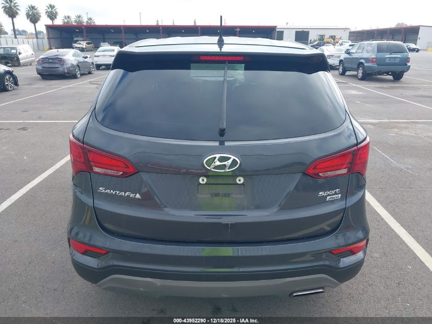 2018 Hyundai Santa Fe Sport 2.4L VIN: 5XYZTDLBXJG569002 Lot: 43952290
