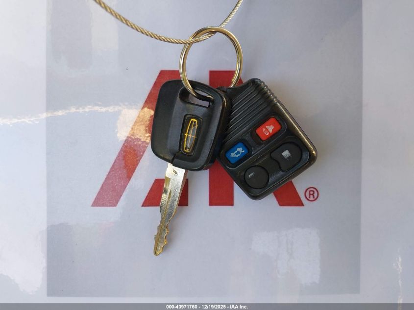 1999 Lincoln Town Car Cartier VIN: 1LNHM83W2XY695286 Lot: 43971760