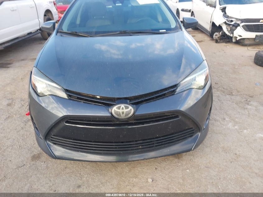2017 Toyota Corolla Le VIN: 5YFBURHE2HP717521 Lot: 43978610