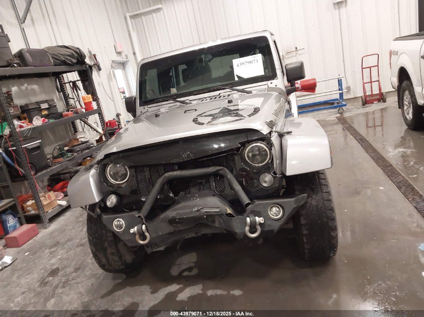 2014 Jeep Wrangler Unlimited Freedom Edition VIN: 1C4BJWDG8EL165414 Lot: 43979071