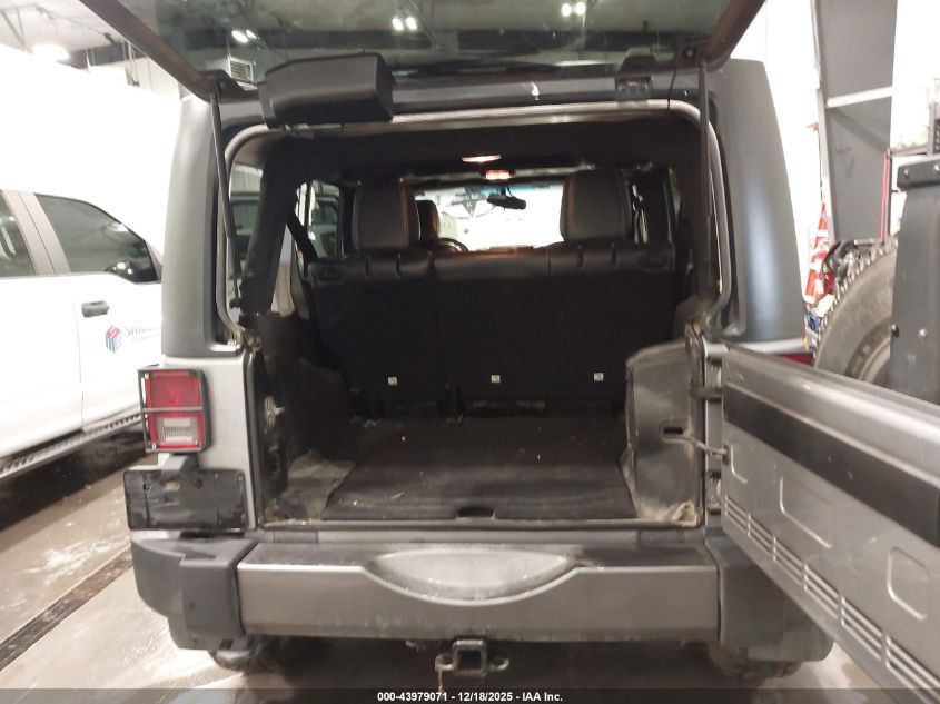 2014 Jeep Wrangler Unlimited Freedom Edition VIN: 1C4BJWDG8EL165414 Lot: 43979071