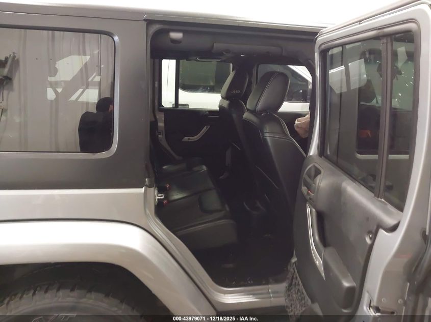 2014 Jeep Wrangler Unlimited Freedom Edition VIN: 1C4BJWDG8EL165414 Lot: 43979071