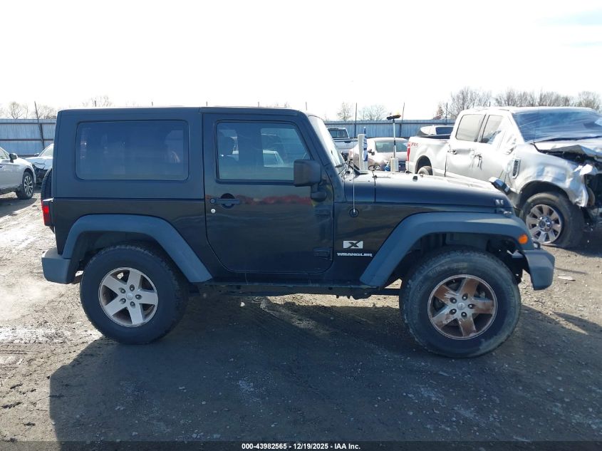 2009 Jeep Wrangler X VIN: 1J4FA24199L710302 Lot: 43982565