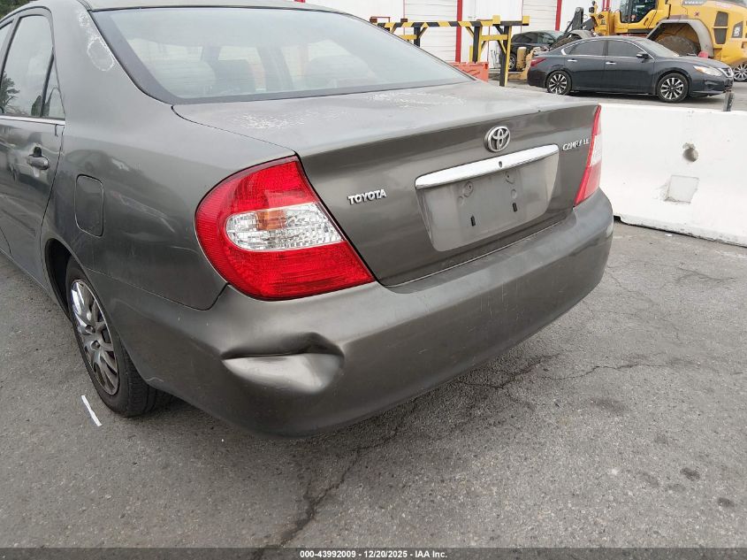 2002 Toyota Camry Le VIN: JTDBE32K520097841 Lot: 43992009