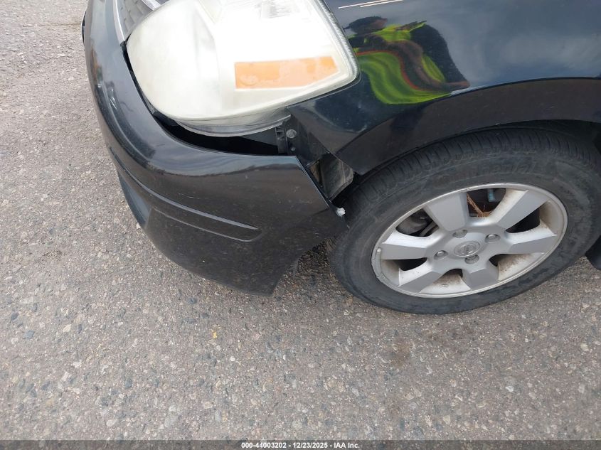 2009 Nissan Versa 1.8Sl VIN: 3N1BC13E09L394034 Lot: 44003202