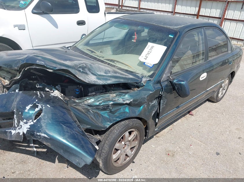 2003 Kia Spectra Ls VIN: KNAFB121835301023 Lot: 44702390