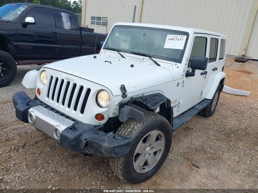 2011 Jeep Wrangler Unlimited Sahara 1J4BA5H17BL636104 photo 1