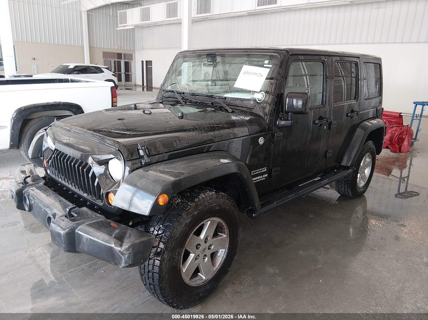 2012 Jeep Wrangler Unlimited Sport 1C4BJWDG7CL266845 photo 1