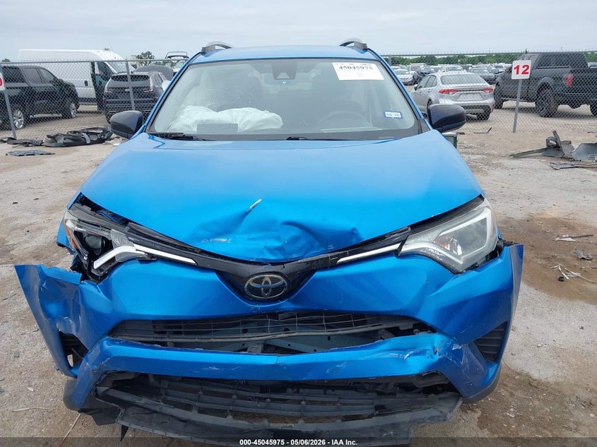 VIN JTMZFREV7JJ735049 2018 TOYOTA RAV4 LE