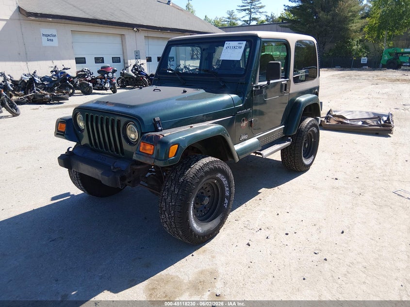 1J4FA59S6YP703110 2000 Jeep Wrangler Sahara photo 1