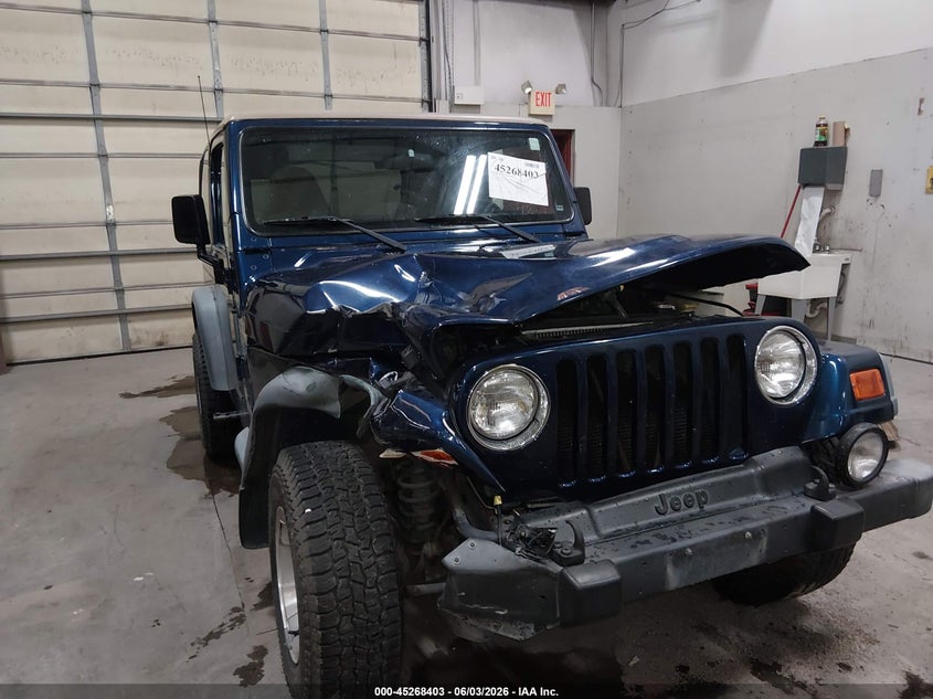 2000 Jeep Wrangler Sport VIN: 1J4FA49S4YP795392 Lot: 45268403