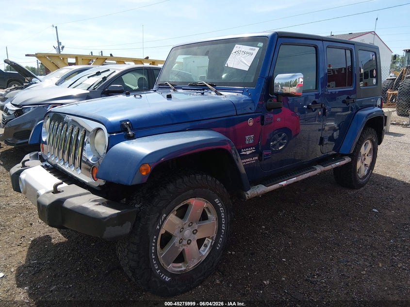 2009 Jeep Wrangler Unlimited Sahara 1J4GA59119L754275 photo 1