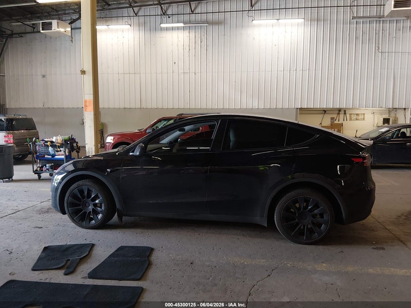 2023 Tesla Model Y Awd/Long Range Dual Motor All-Wheel Drive VIN: 7SAYGDEEXPF885896 Lot: 45300125