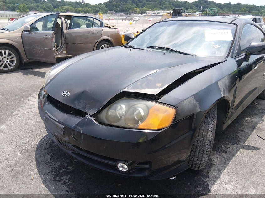 2004 Hyundai Tiburon VIN: KMHHM65DX4U107203 Lot: 45337014
