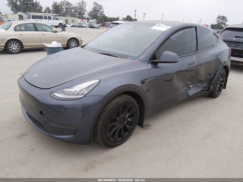 2023 Tesla Model Y, Left Side, IAAI, VIN 7SAYGDEEXPA128932 — photo 2