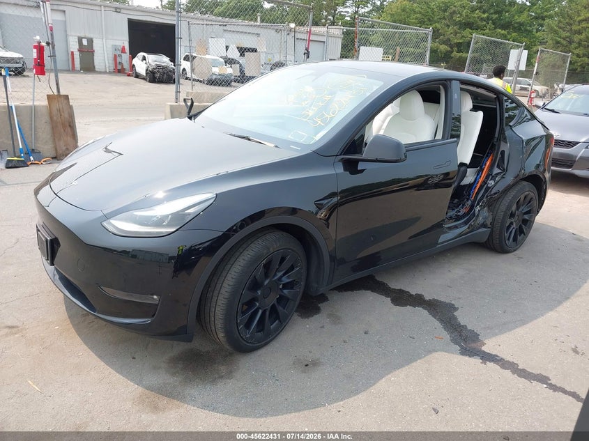 2023 Tesla Model Y, Left Side, IAAI, VIN 7SAYGAEE8PF902600 — photo 2