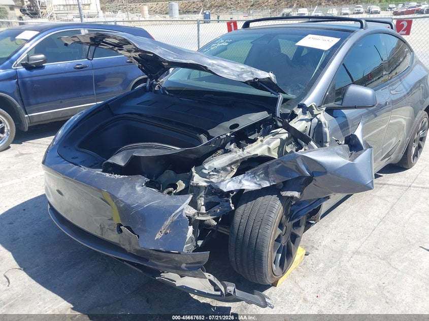 2023 Tesla Model Y Awd/Long Range Dual Motor All-Wheel Drive VIN: 7SAYGAEEXPF620474 Lot: 45667652