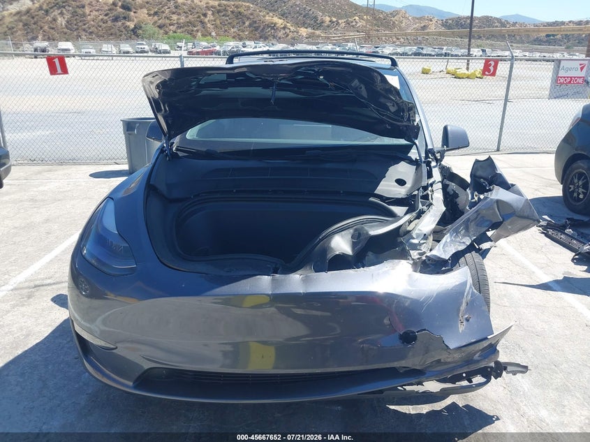 2023 Tesla Model Y Awd/Long Range Dual Motor All-Wheel Drive VIN: 7SAYGAEEXPF620474 Lot: 45667652