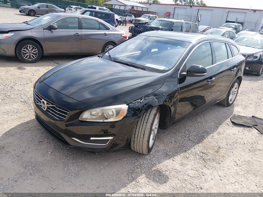 2015 Volvo V60, Left Front, IAAI, VIN YV140MEBXF1207429 — photo 2