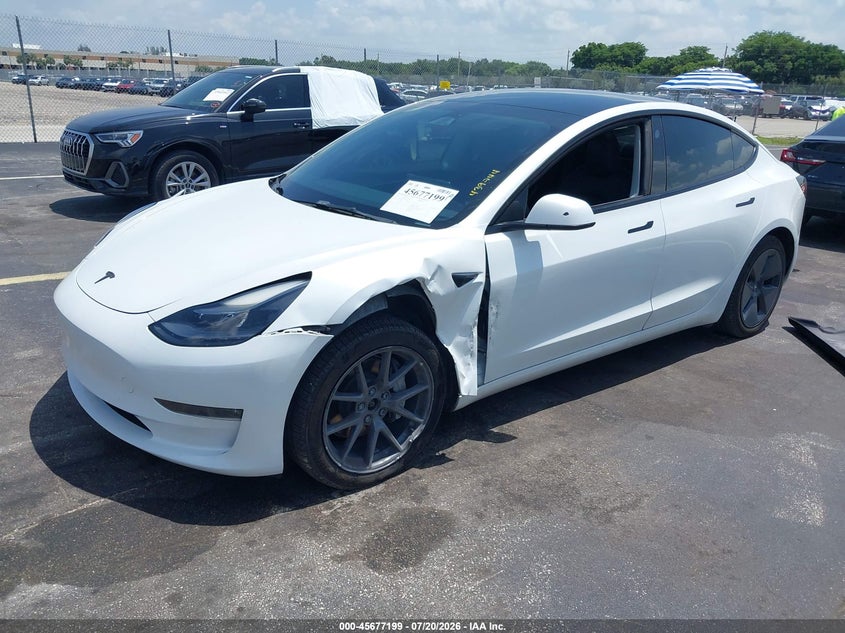 2023 Tesla Model 3, Left Front, IAAI, VIN 5YJ3E1EB4PF388456 — photo 2