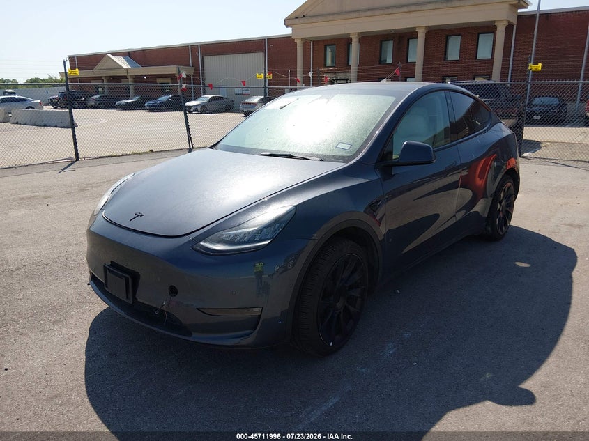 2023 Tesla Model Y, All Over, IAAI, VIN 7SAYGAEE5PF584659 — photo 2