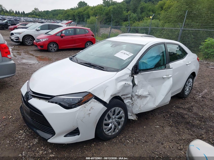 2018 Toyota Corolla, Left Side, IAAI, VIN 5YFBURHEXJP819574 — photo 2