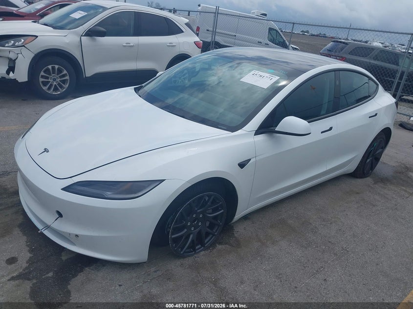2026 Tesla Model 3, Left Front, IAAI, VIN 5YJ3E1EA7TF190942 — photo 2