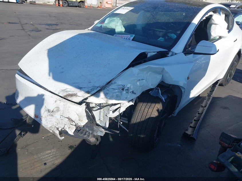 2026 Tesla Model Y, Left Front, IAAI, VIN 7SAYGDEE9TF647516 — photo 2