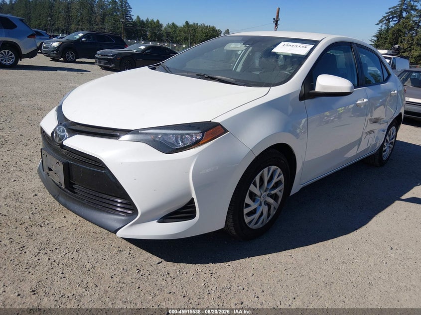 2017 Toyota Corolla, Левый бок, IAAI, VIN 5YFBURHE3HP647592 — фото 2