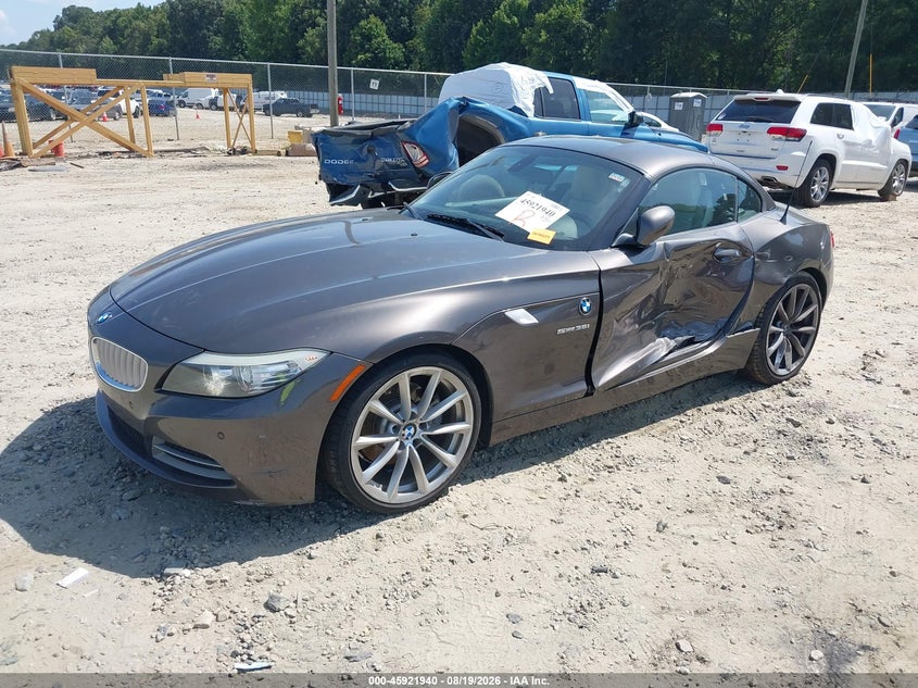 2011 BMW Z4, Левый бок, IAAI, VIN WBALM7C54BE383994 — фото 2