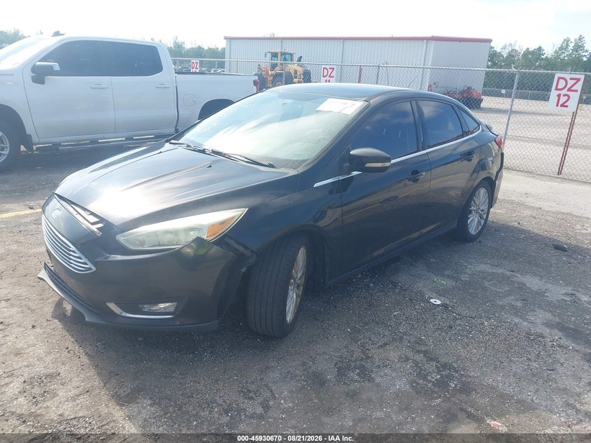 2015 Ford Focus, Front & Rear, IAAI, VIN 1FADP3J22FL267720 — photo 2