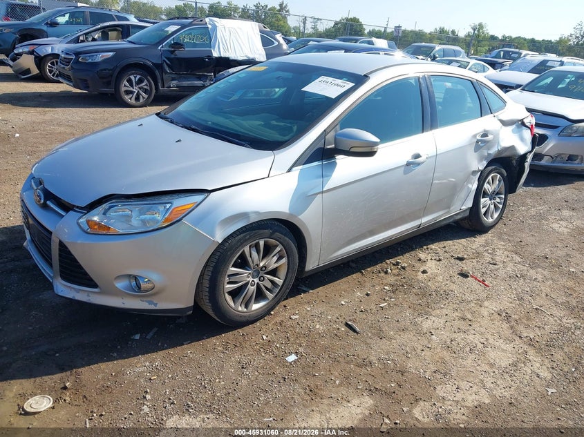2012 Ford Focus, Левый зад, IAAI, VIN 1FAHP3H21CL430943 — фото 2