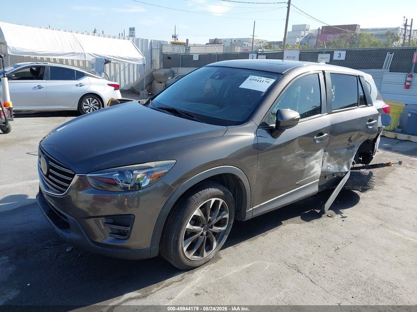 2016 Mazda CX-5, Левый бок, IAAI, VIN JM3KE2DY2G0850588 — фото 2