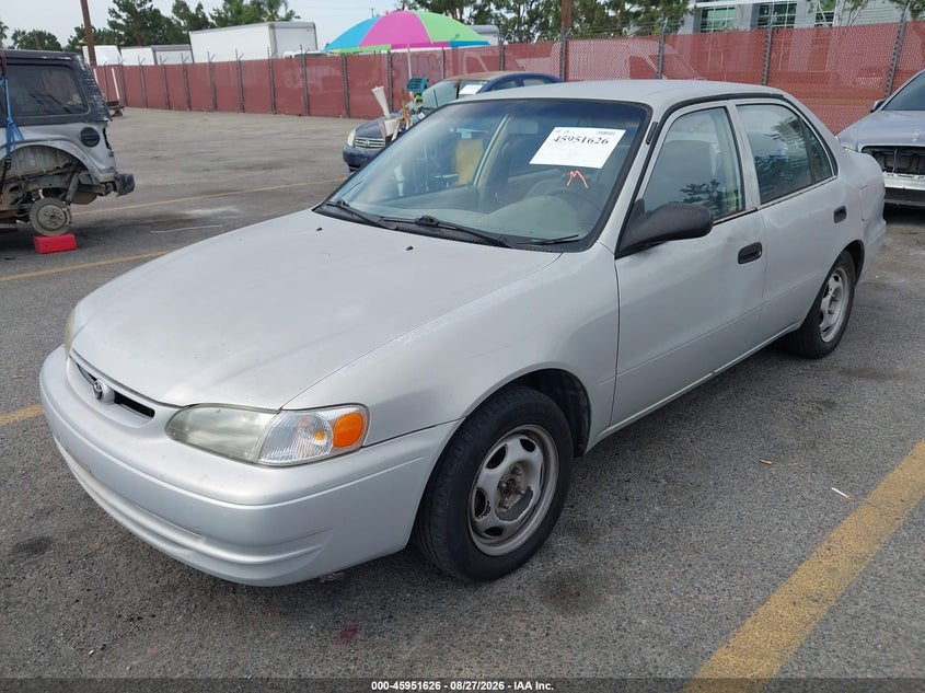 2000 Toyota Corolla, Левый бок, IAAI, VIN 1NXBR12E7YZ320414 — фото 2