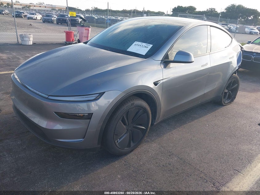 2026 Tesla Model Y, Левый зад, IAAI, VIN 7SAYGDED9TA477971 — фото 2