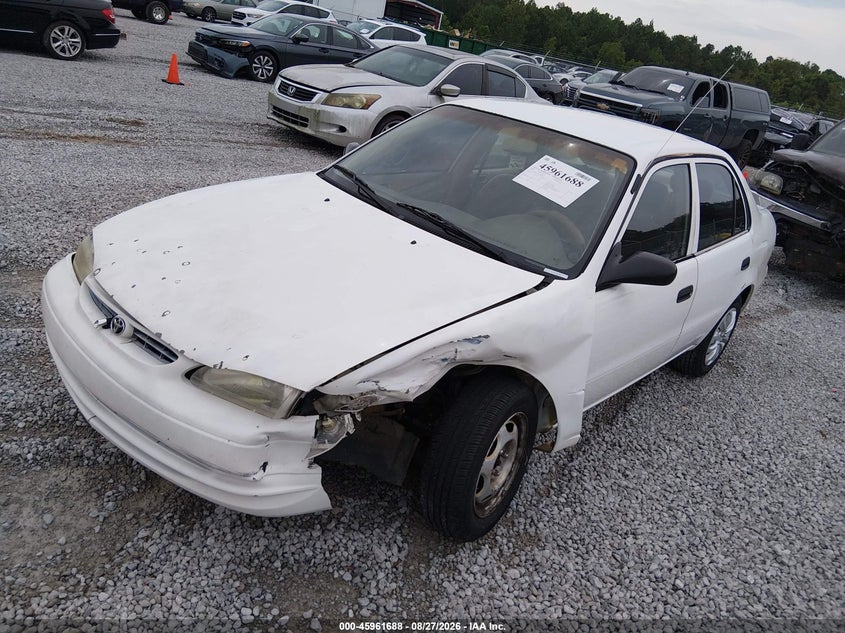 2000 Toyota Corolla, Left Front, IAAI, VIN 1NXBR12E5YZ403808 — photo 2