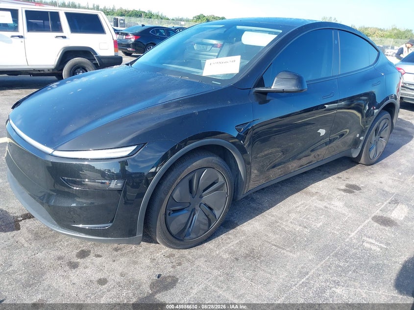 2026 Tesla Model Y, Left Front, IAAI, VIN 7SAYGDED4TF381619 — photo 2