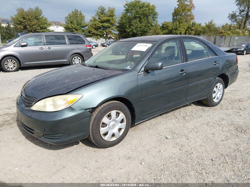 2002 Toyota Camry Le, Front & Rear, IAAI, VIN 4T1BE32K32U576893 — photo 2