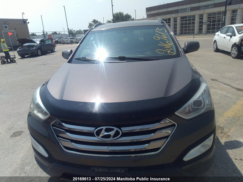 2014 Hyundai Santa Fe Sport 2.0T VIN: 5XYZUDLA9EG211013 Lot: 20169613