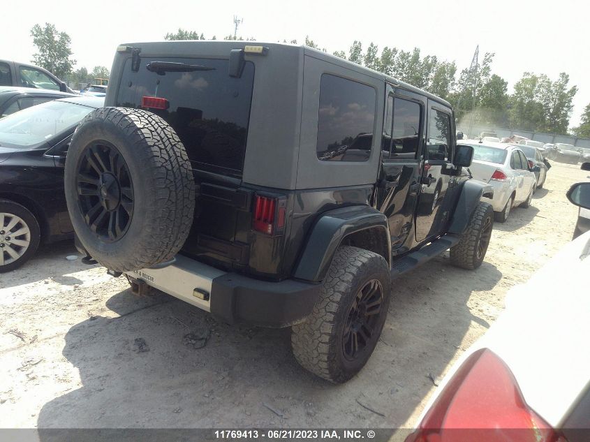 2010 Jeep Wrangler Unlimited Sahara VIN: 1J4BA5H13AL220727 Lot: 11769413