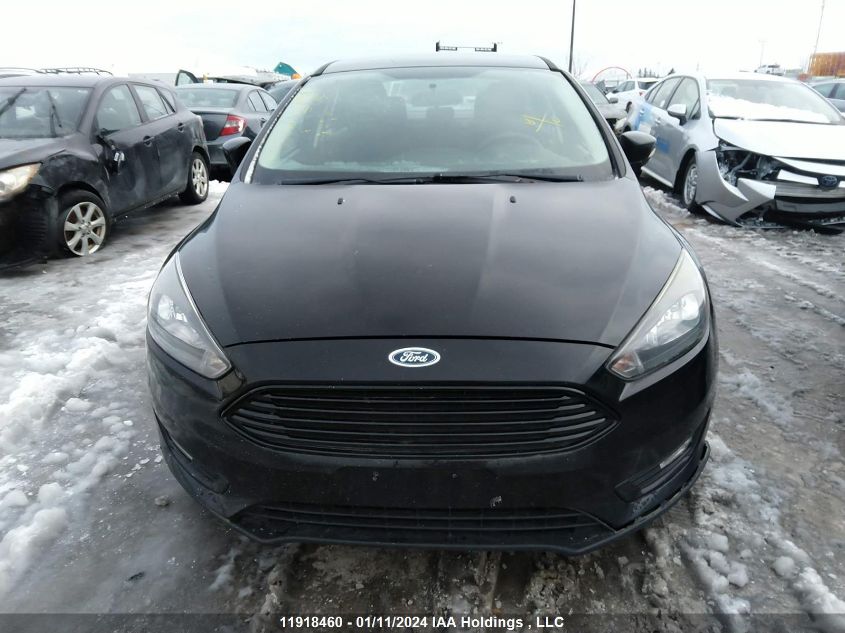 2018 Ford Focus Se VIN: 1FADP3FEXJL273633 Lot: 11918460