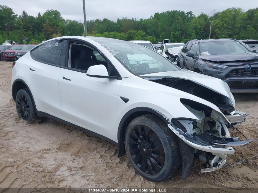 2023 Tesla Model Y VIN: LRWYGDEE0PC028994 Lot: 11934097