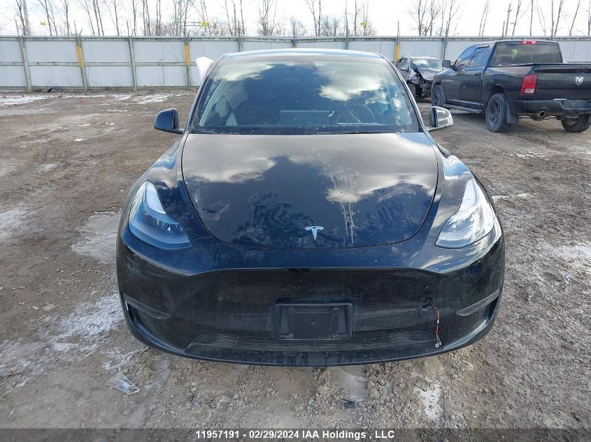 2024 Tesla Model Y VIN: 7SAYGDEE4RF989335 Lot: 11957191